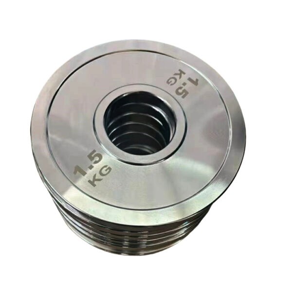 Polished steel solid Olympic weight plates stacked
