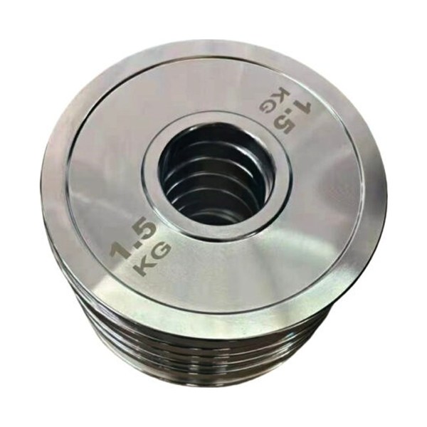 Polished steel solid Olympic weight plates stacked