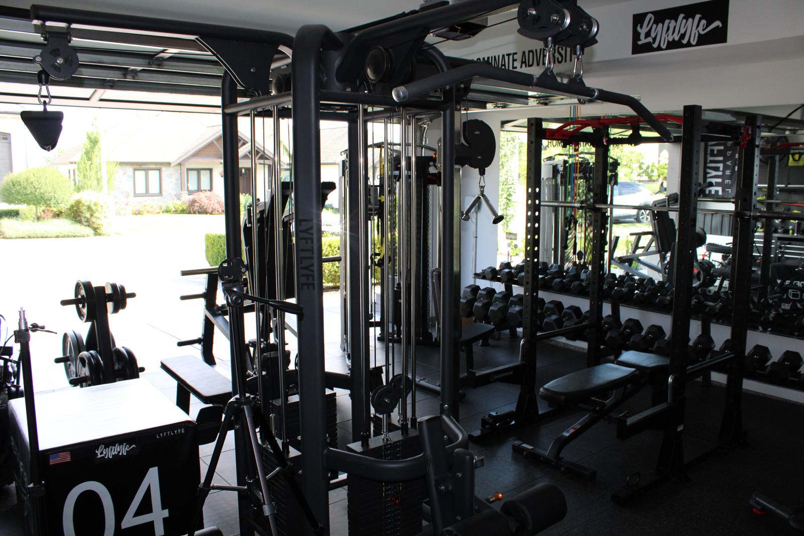 Custom garage gym build in Abbotsford, BC — rig-grade equipment, cable machine, and dumbbell rack